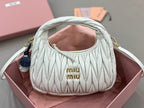 MiuMiu light mint quilted mini hobo bag with gold-tone hardware and dual handles