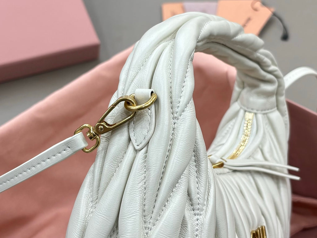 MiuMiu light mint quilted hobo bag clasp and strap hardware close-up