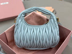 MiuMiu light blue ruched hobo bag with open top and stitched pleats