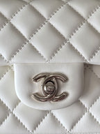 Chanel quilted white flap bag with CC logo turn-lock clasp