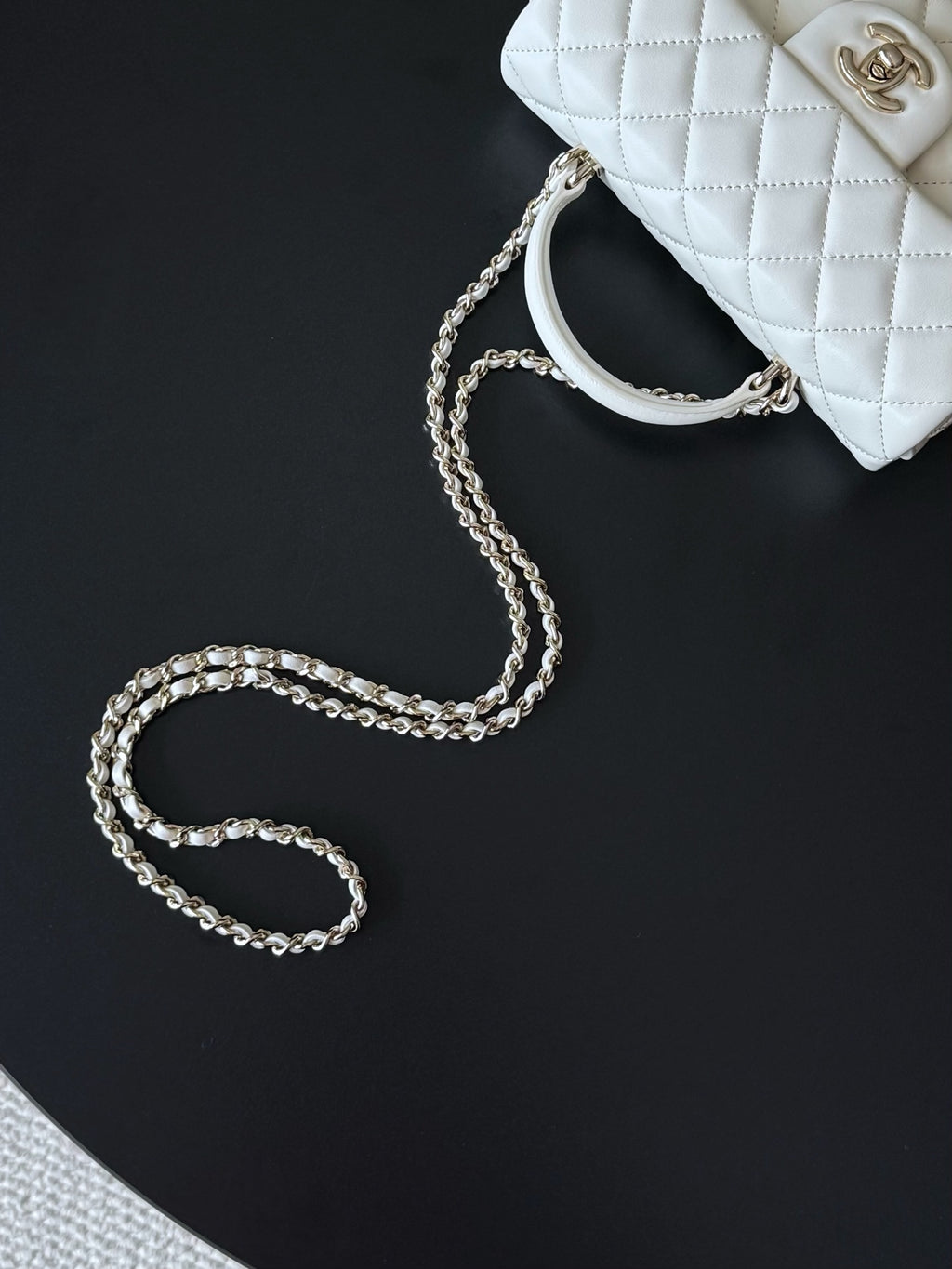 Chanel quilted white handbag with silver-tone chain strap
