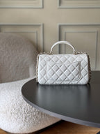 Chanel quilted white mini bag with top handle and chain strap