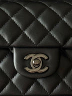Chanel quilted leather mini bag with CC logo clasp, black