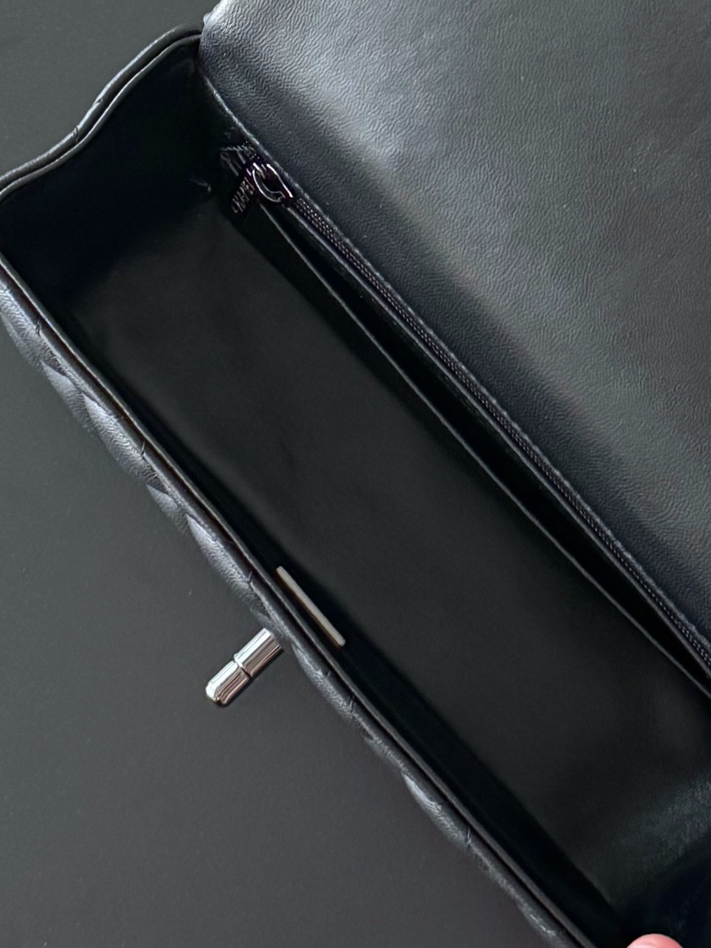 Chanel quilted leather mini bag open interior, black with zip pocket