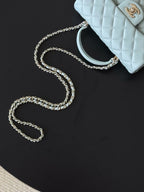 Chanel bag light blue with silver-tone chain strap and gold-tone logo detail