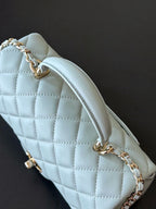 Chanel bag in light blue with quilted body and gold-tone chain shoulder strap