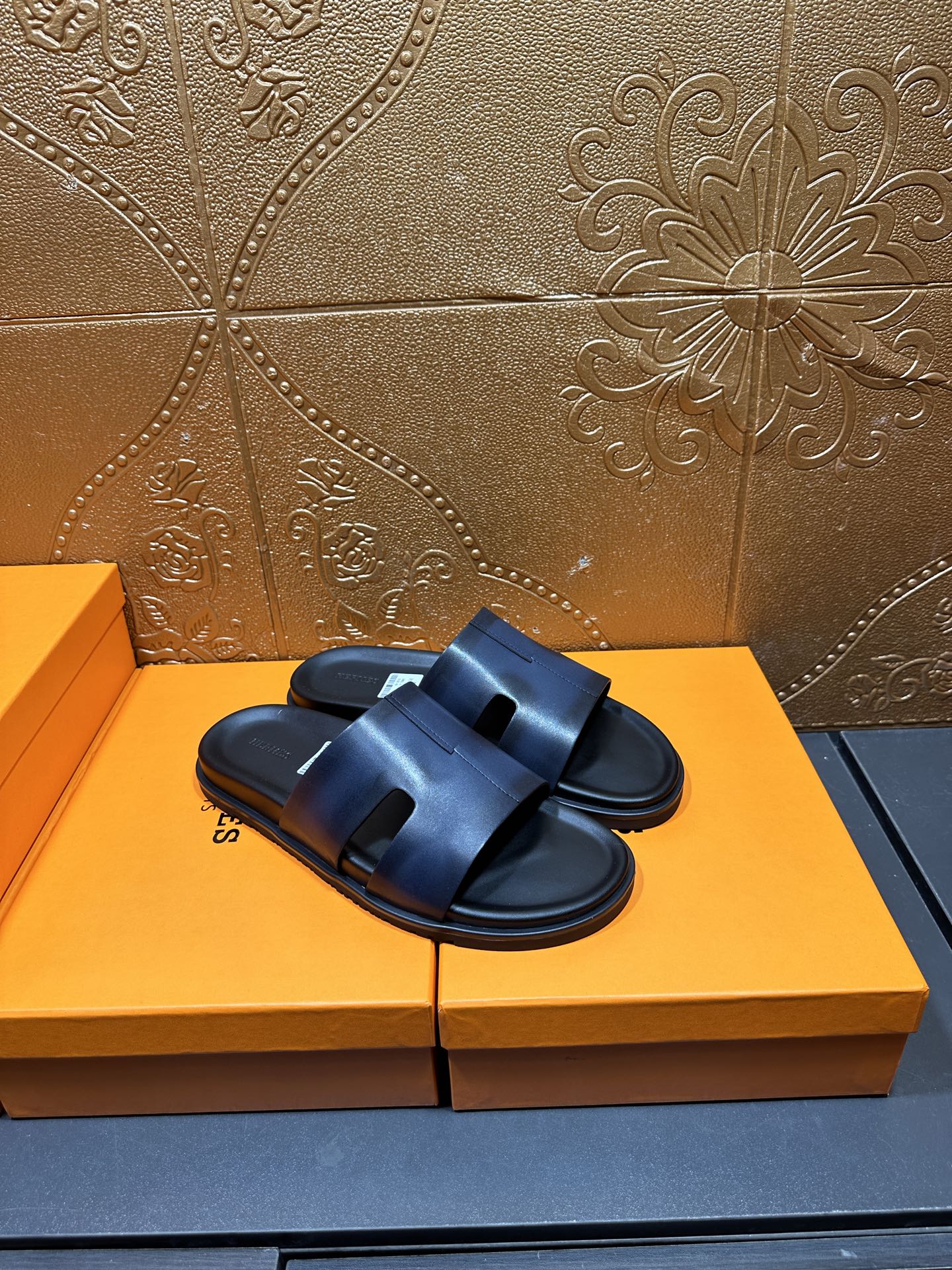Hermes dark blue leather slide sandals, front view with open toe and strap