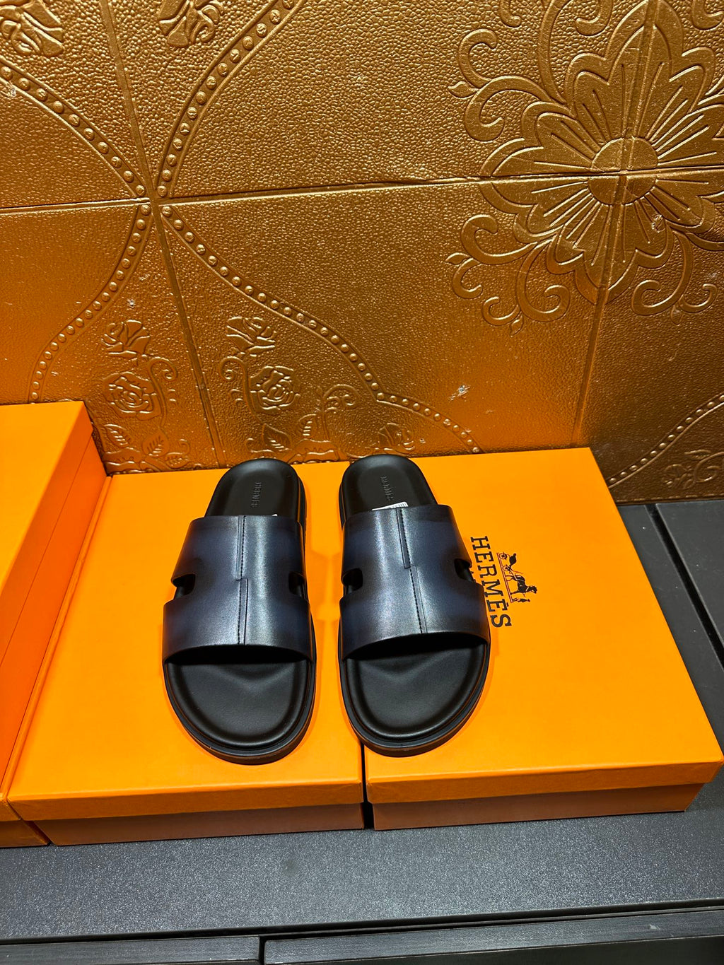 Hermes dark blue leather slide sandals with wide cross strap and open toe
