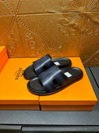 Hermes dark blue slide sandals with two wide straps and cushioned footbed