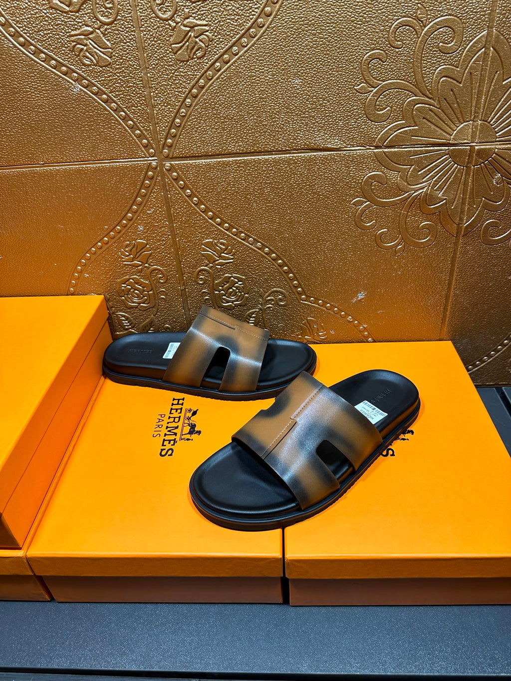 Hermes slide sandals with gray-tan straps and dark footbed, open toe