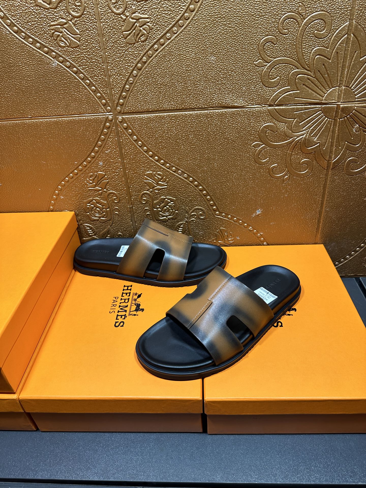 Hermes slide sandals with gray-tan straps and dark footbed, open toe