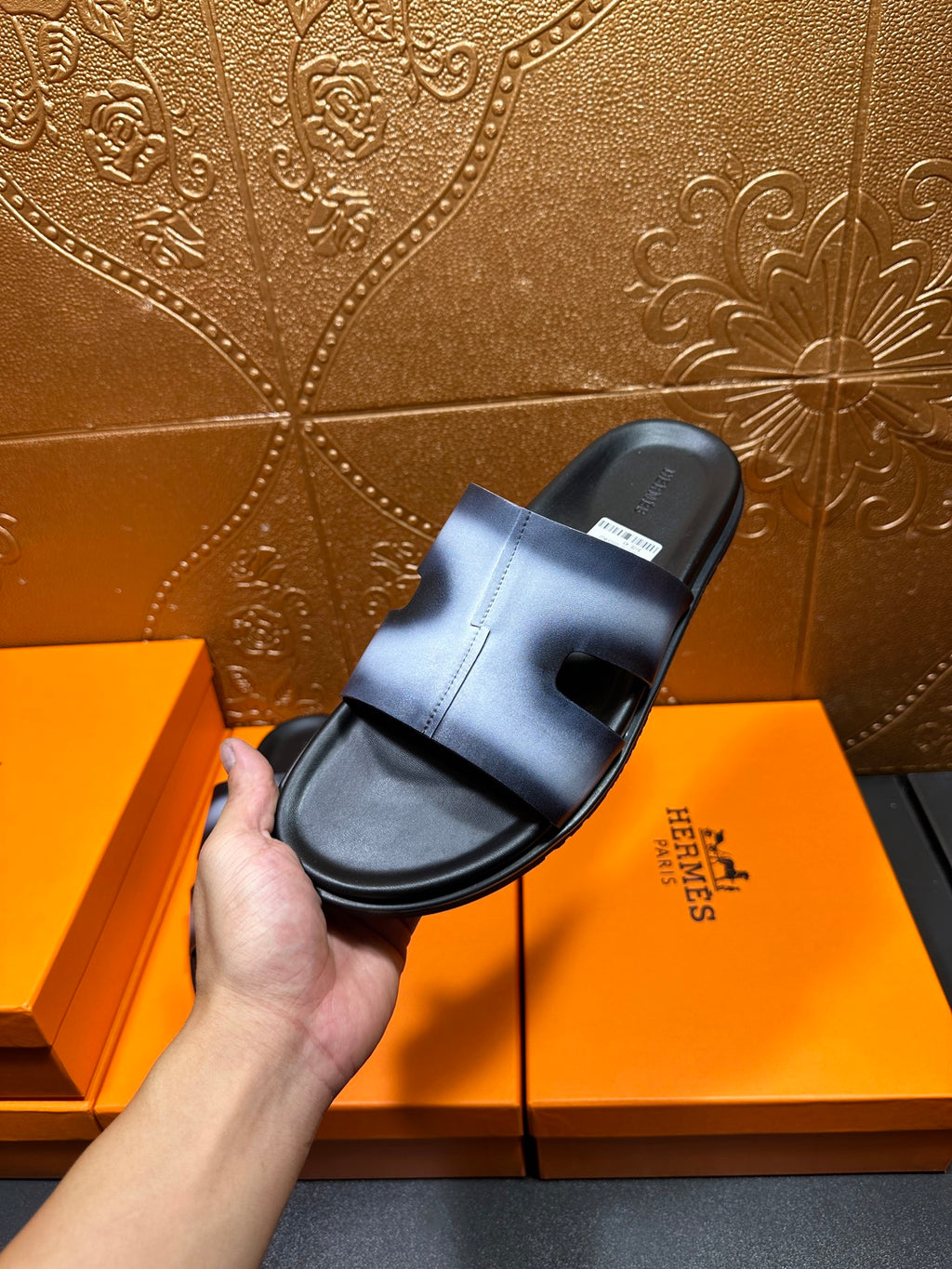Hermes slide sandal in hand, metallic blue upper and black textured sole