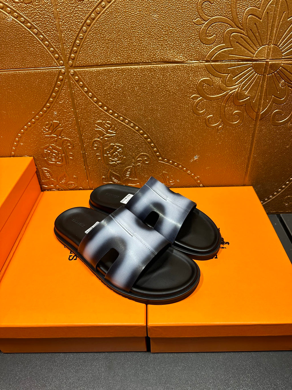 Hermes slide sandals, metallic blue straps across open toes, black footbed
