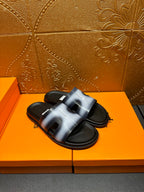 Hermes slide sandals, metallic blue straps across open toes, black footbed
