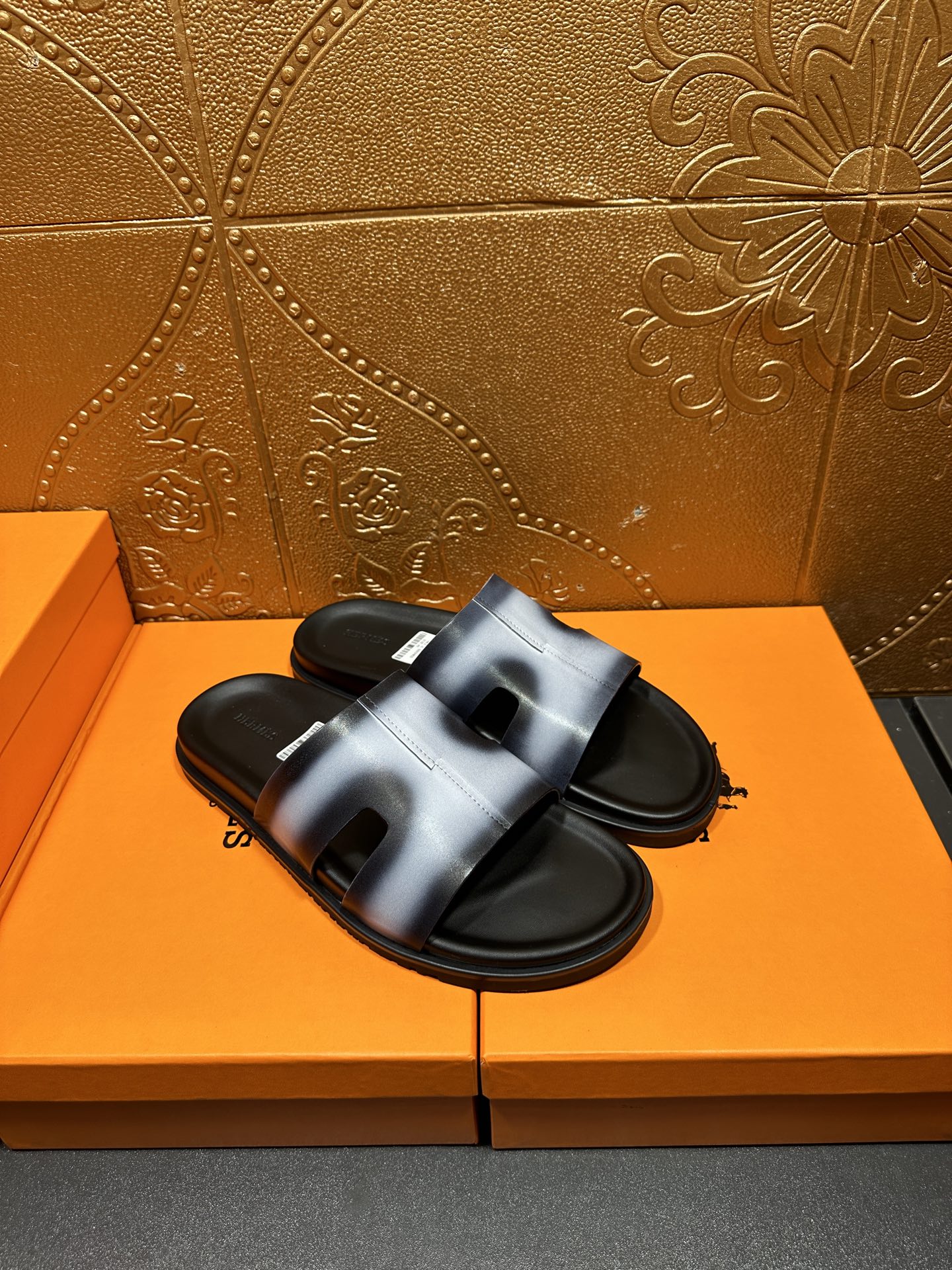 Hermes slide sandals, metallic blue straps across open toes, black footbed