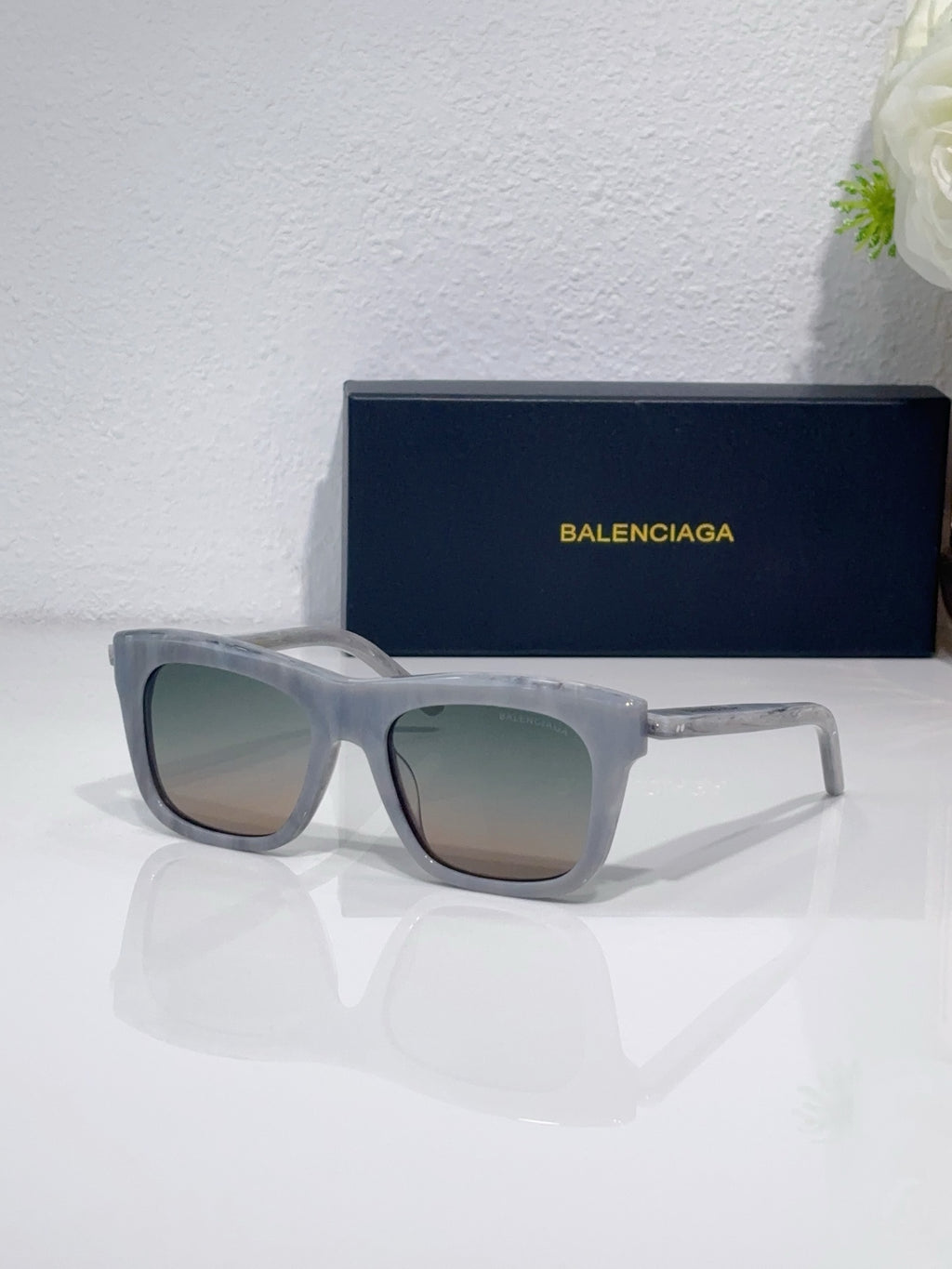 Balenciaga square sunglasses with translucent light gray frame and gray lenses