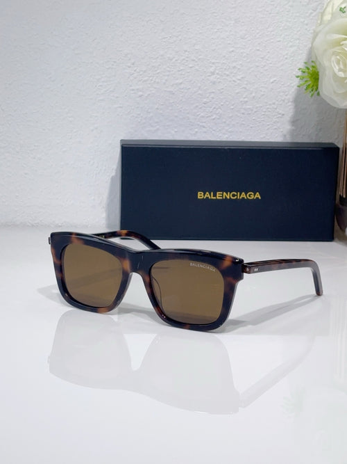 Balenciaga square sunglasses with dark frame and amber-tinted lenses