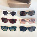 Bvlgari sunglasses lineup of six pairs: white, black, burgundy, pink, teal, and navy