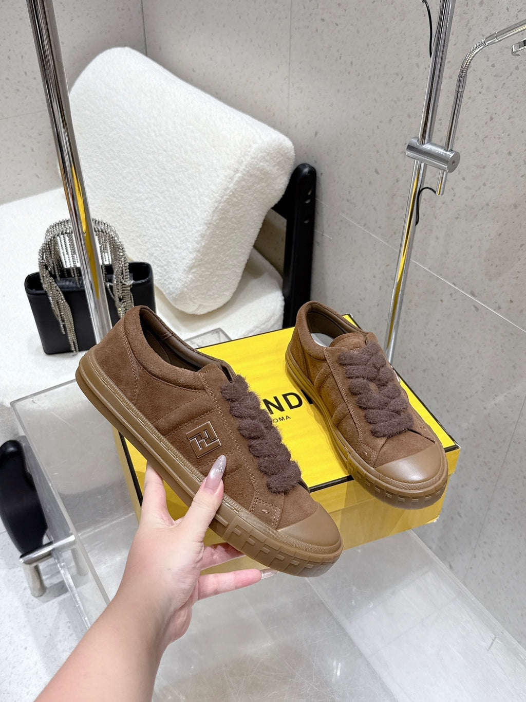 Brown suede sneakers with fuzzy laces, side logo plate and thick rubber sole