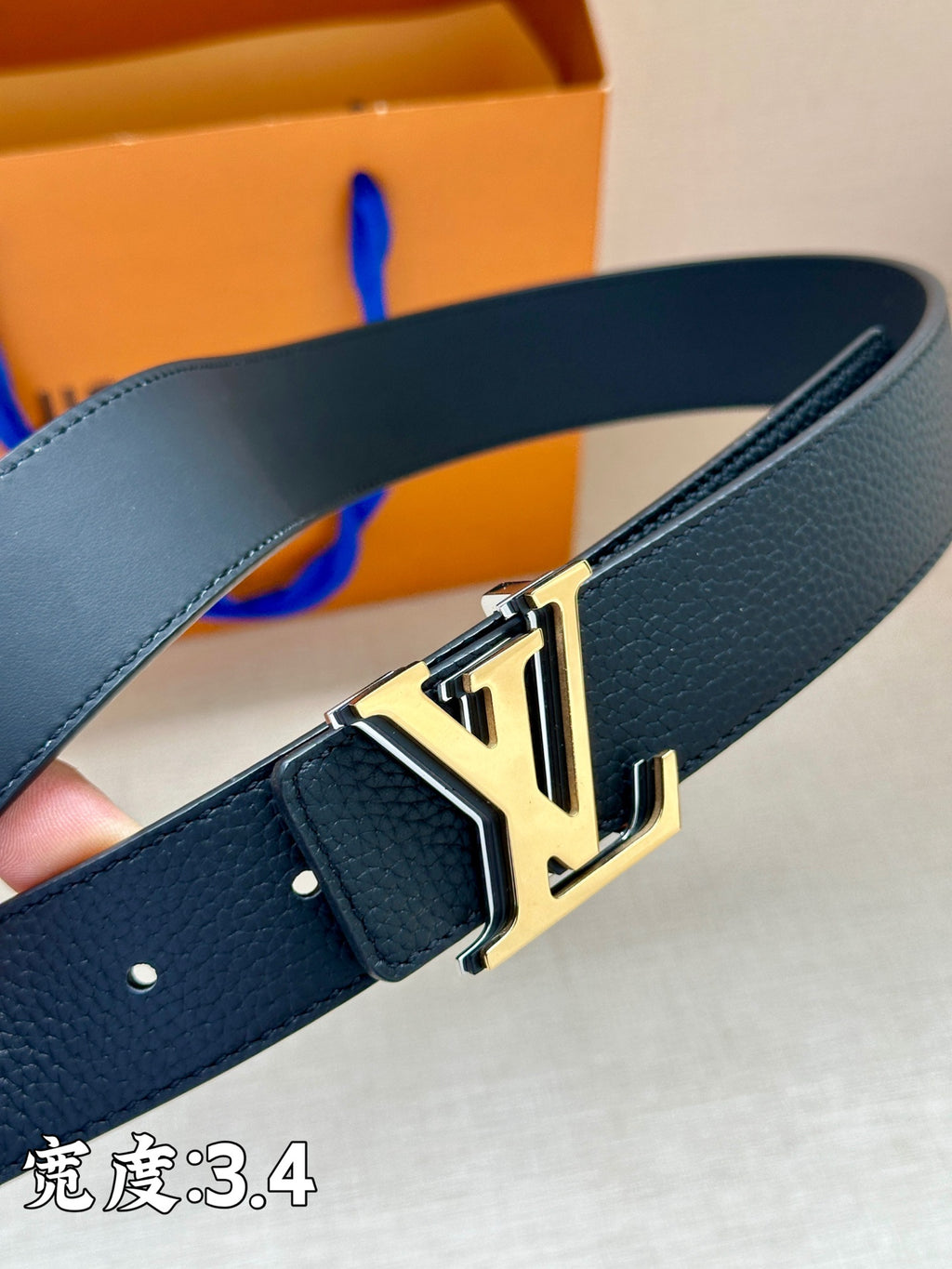 Louis Vuitton belt, dark blue leather with gold-tone rectangular LV buckle