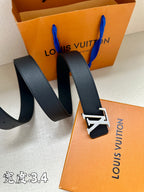 Louis Vuitton belt with dark blue leather strap and gold-tone LV buckle