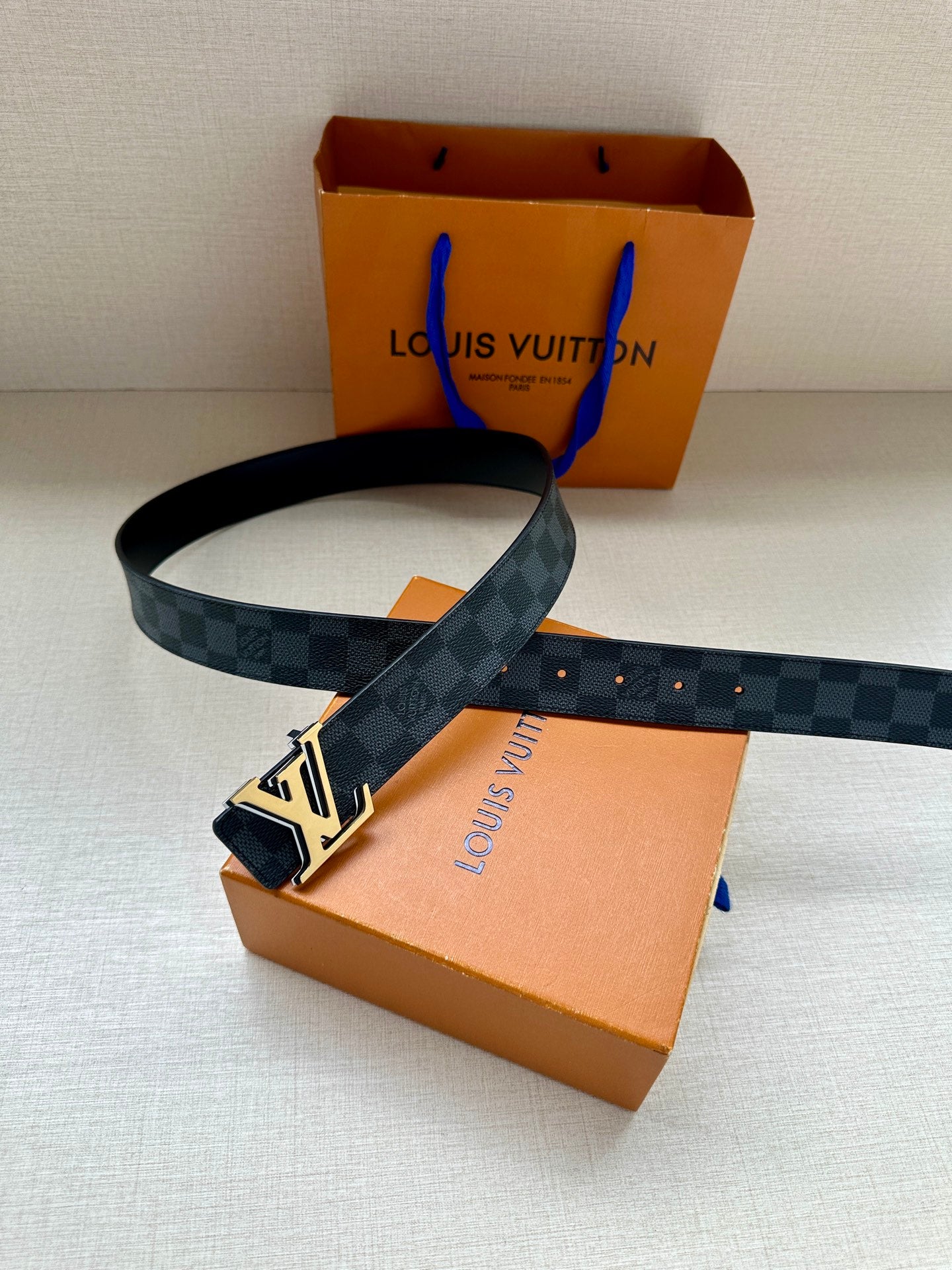 Monogram belt, dark blue check strap with gold-tone buckle and adjustable end