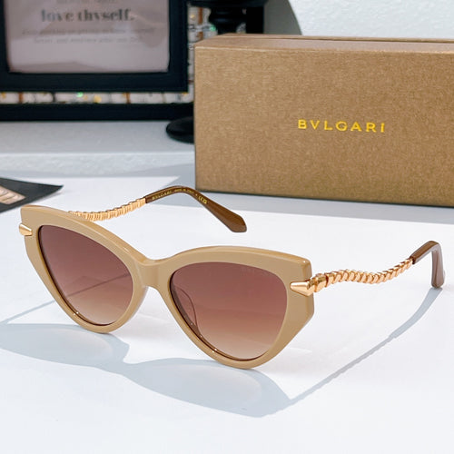 Cat-eye sunglasses with cream frames, gold chain temples, rose-tinted lenses