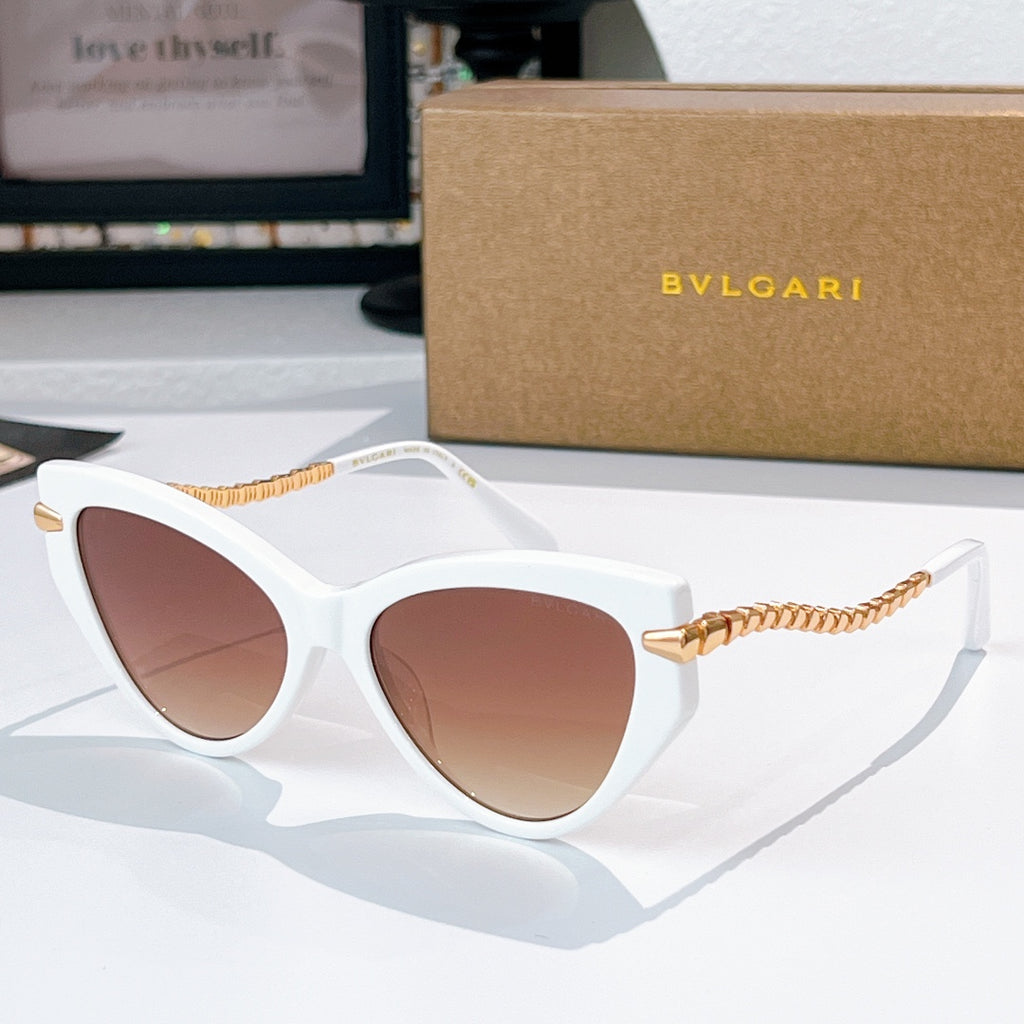 Cat-eye sunglasses with white frames, gold chain temples, brown-tinted lenses