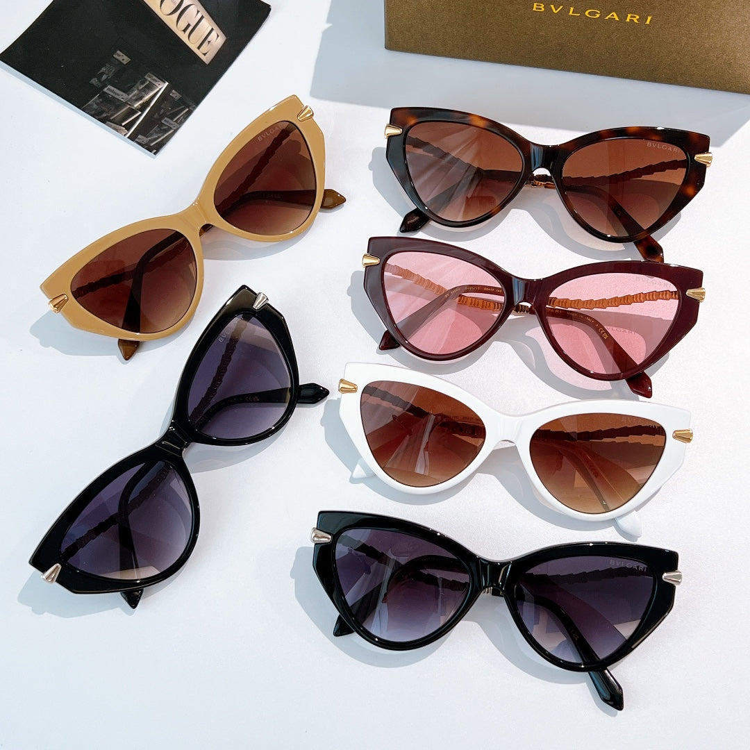 Cat-eye sunglasses assortment with various frames and tinted lenses, gold-accent temples