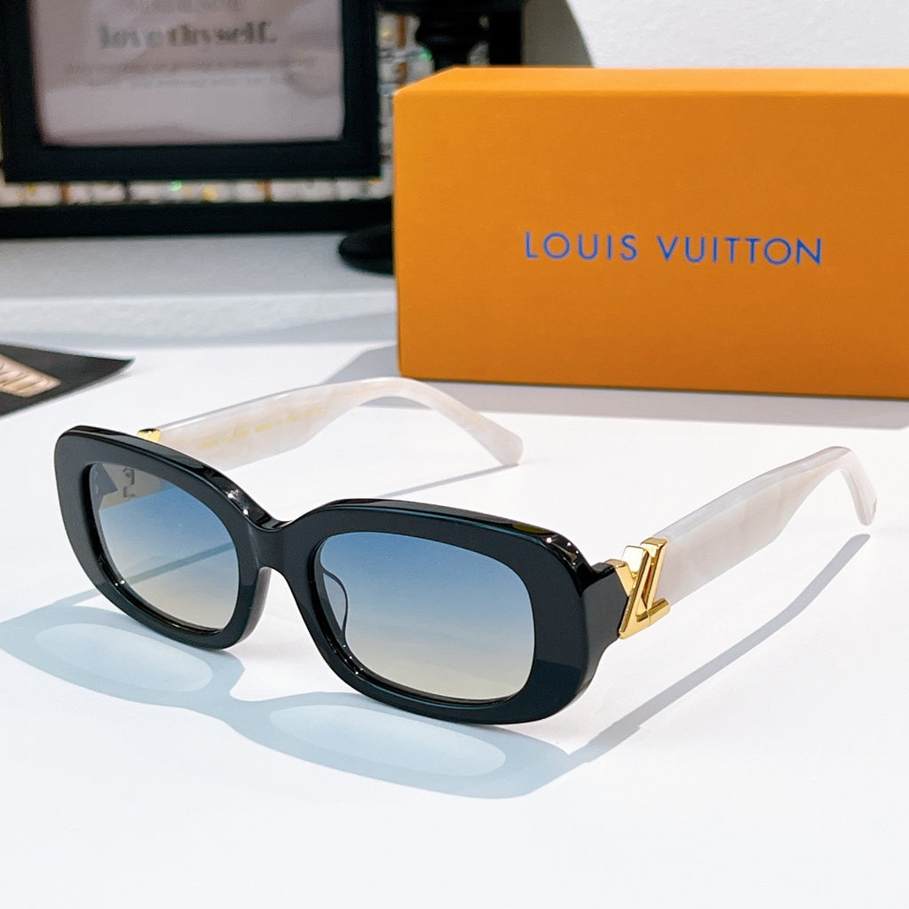 Louis Vuitton sunglasses with dark frame and blue gradient lenses, gold logo hinges