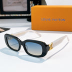 Louis Vuitton sunglasses with dark frame and blue gradient lenses, gold logo hinges