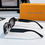 Louis Vuitton sunglasses, black frame with gold logo emblem and angular temple arms