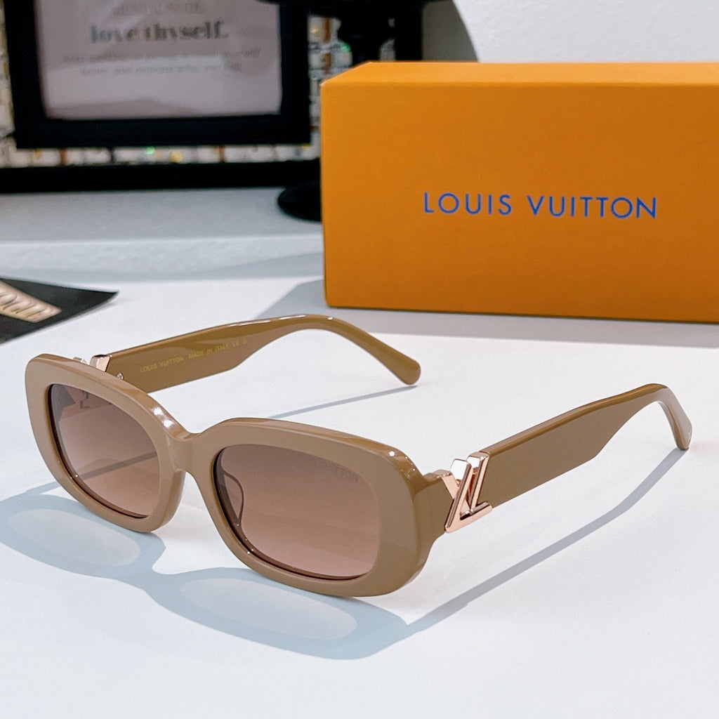 Louis Vuitton sunglasses with tan frame and brown gradient lenses, gold logo hinges