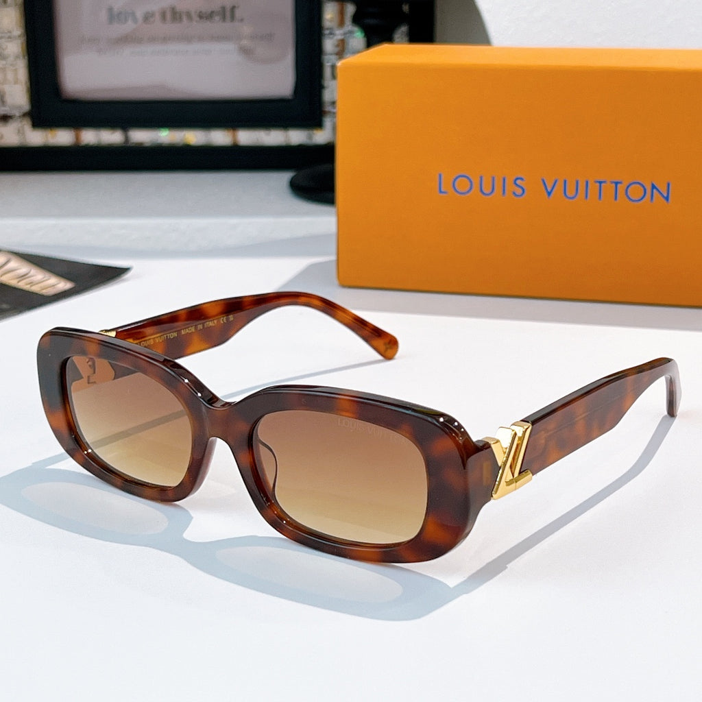 Louis Vuitton sunglasses with tortoiseshell frame and light brown gradient lenses, gold logo