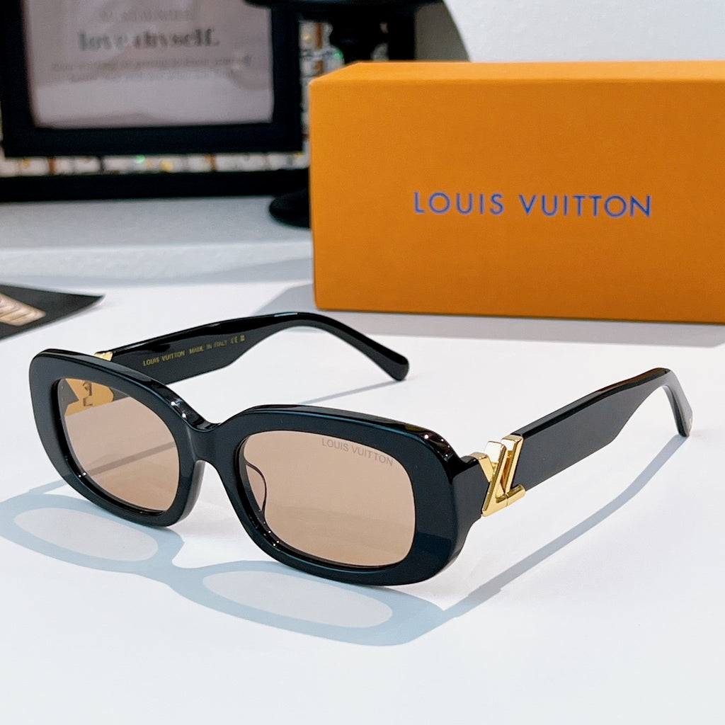 Louis Vuitton sunglasses with dark frame and beige gradient lenses, gold logo hinges