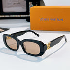 Louis Vuitton sunglasses with dark frame and beige gradient lenses, gold logo hinges