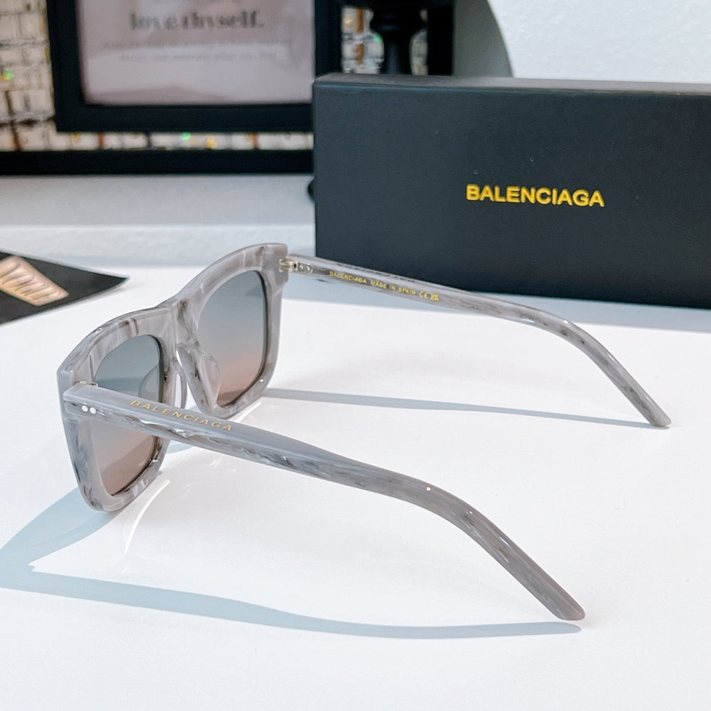 Balenciaga sunglasses with clear frame and rose tinted lenses