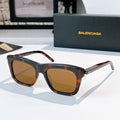 Balenciaga sunglasses with dark tortoiseshell frame and amber tinted lenses