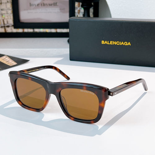 Balenciaga sunglasses with dark tortoiseshell frame and amber tinted lenses