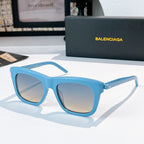 Balenciaga sunglasses with light blue frame and tinted gray lenses