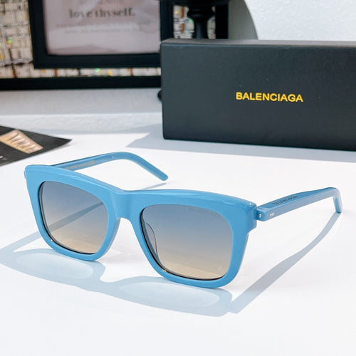 Balenciaga sunglasses with light blue frame and tinted gray lenses