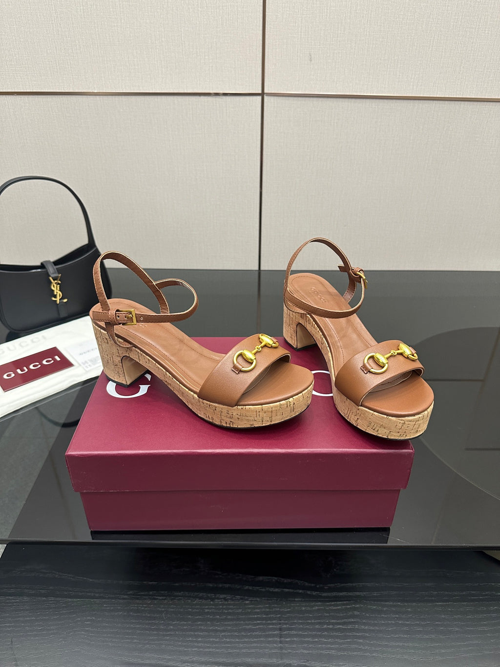 Gucci ladies tan platform sandals with gold buckle toe strap and cork-style midsole