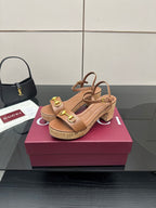 Gucci ladies tan platform sandals with gold buckle detail and block heel, side view