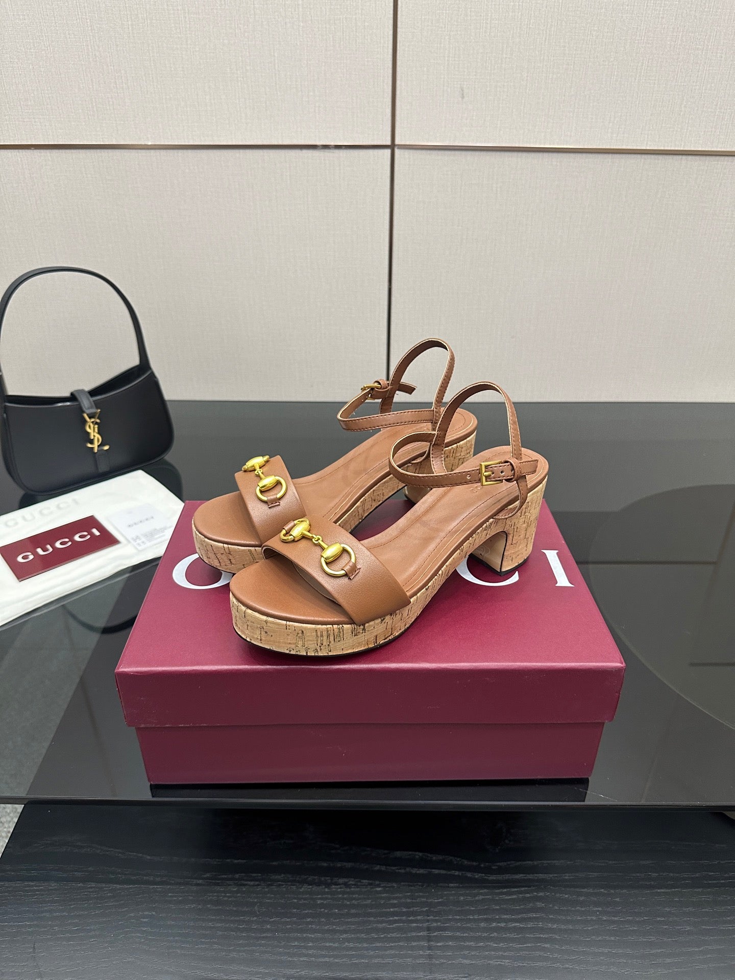 Gucci ladies tan platform sandals with gold buckle detail and block heel, side view