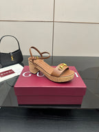 Gucci ladies tan platform sandals with gold buckle toe strap and cork-style sole