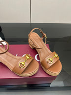 Gucci ladies tan platform sandals, gold buckle hardware and cork-style sole close-up
