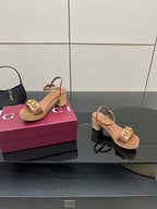 Gucci ladies tan platform sandals with gold buckle straps and cork-style sole, two shoes visible