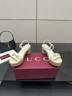 Gucci white heeled slingback sandals with gold horsebit hardware