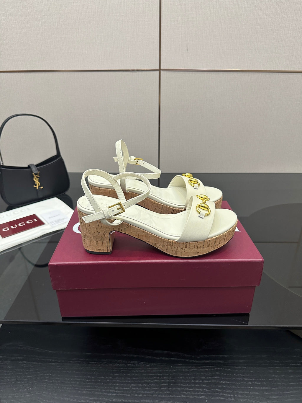 Gucci white heeled platform sandals with gold horsebit hardware and cork sole