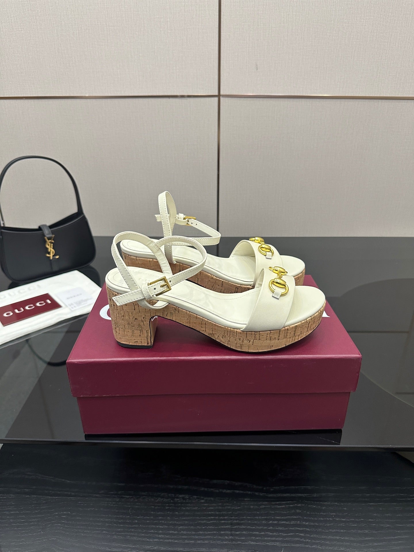 Gucci white heeled platform sandals with gold horsebit hardware and cork sole